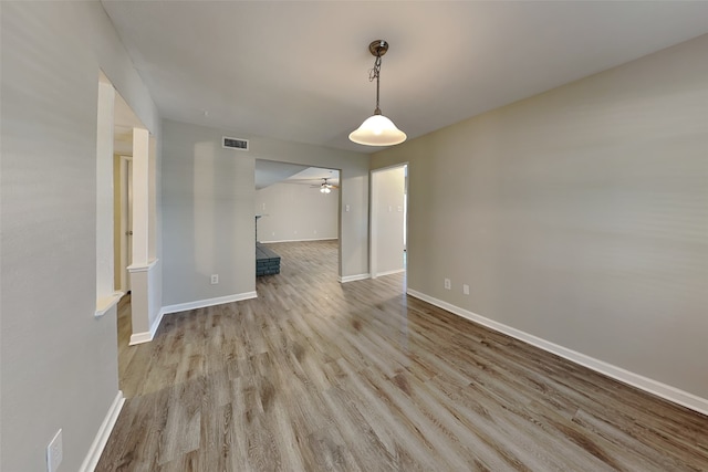 1625 Stockton Trl, Plano, TX 75023 - empty room with ceiling fan, wood finished floors, and baseboards