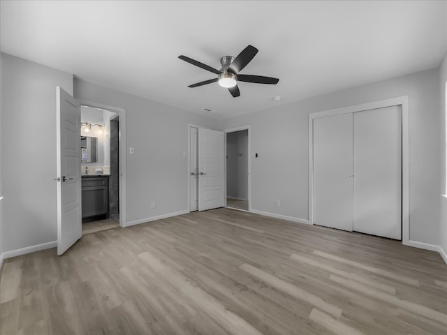 6927 Clearglen Dr, Dallas, TX 75232 - unfurnished bedroom with multiple closets, light wood-style flooring, baseboards, ensuite bath, and ceiling fan