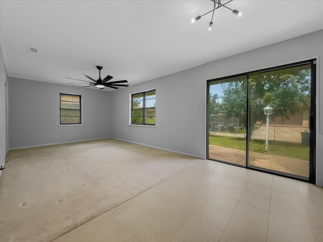 6927 Clearglen Dr, Dallas, TX 75232 - spare room with light colored carpet, baseboards, a ceiling fan, and light tile patterned flooring