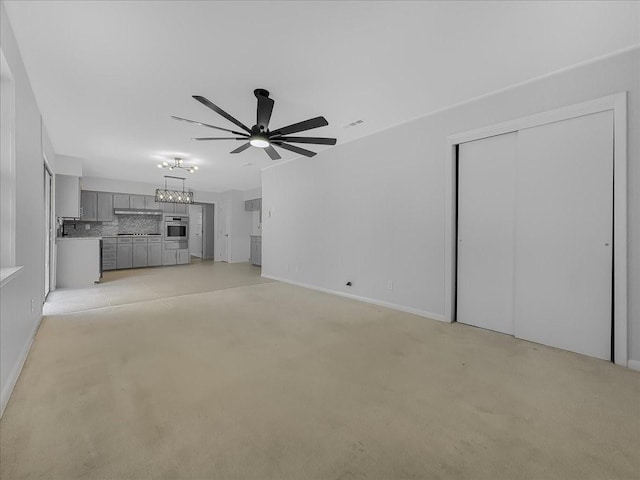 6927 Clearglen Dr, Dallas, TX 75232 - unfurnished living room with a ceiling fan, a chandelier, and baseboards