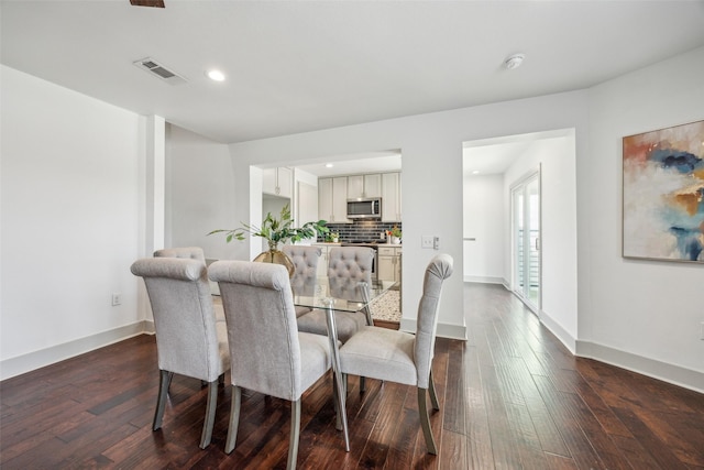 1964 W Davis St, Dallas, TX 75208 - dining space featuring dark wood finished floors, baseboards, and recessed lighting