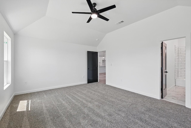 9413 Prairieview Dr, Fort Worth, TX 76134 - unfurnished bedroom with vaulted ceiling, baseboards, carpet flooring, connected bathroom, and a ceiling fan