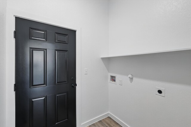 9413 Prairieview Dr, Fort Worth, TX 76134 - laundry room featuring wood finished floors, hookup for a washing machine, baseboards, electric dryer hookup, and gas dryer hookup