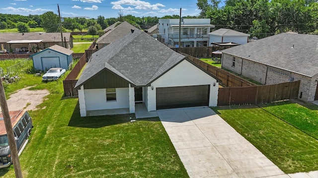 9413 Prairieview Dr, Fort Worth, TX 76134 - view of front facade with roof with shingles, an attached garage, driveway, stucco siding, and a residential view
