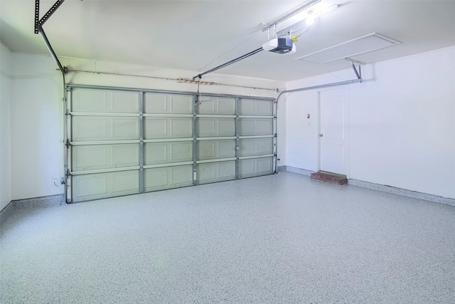 garage with a garage door opener and baseboards