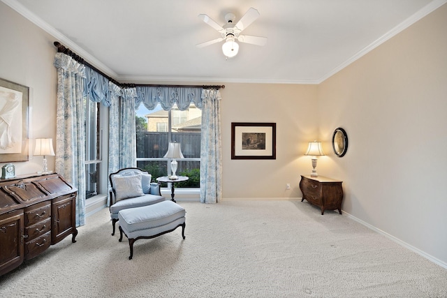 living area featuring crown molding, baseboards, light carpet, and ceiling fan