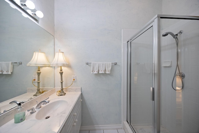 full bath with a stall shower and vanity