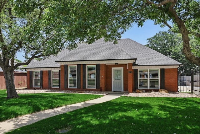 view of front of house with a shingled roof and brick siding