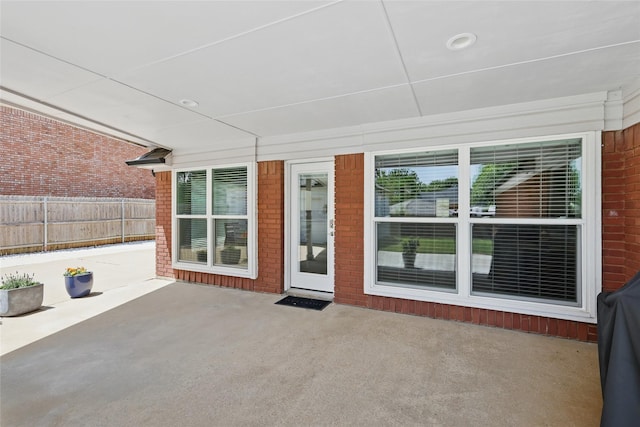 view of patio / terrace featuring fence