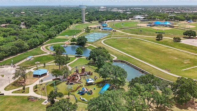 view of property location with a park and a nearby body of water