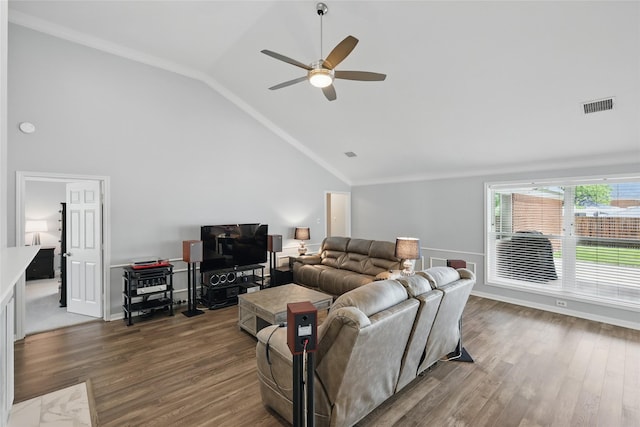 living area with vaulted ceiling, a ceiling fan, wood finished floors, and crown molding