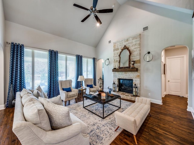 6209 Crystal Cove Ct, Mckinney, TX 75071 - living room featuring high vaulted ceiling, ceiling fan, arched walkways, wood finished floors, and baseboards