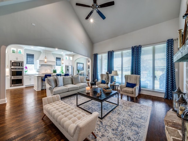 6209 Crystal Cove Ct, Mckinney, TX 75071 - living room with arched walkways, high vaulted ceiling, ceiling fan, dark wood-style floors, and plenty of natural light