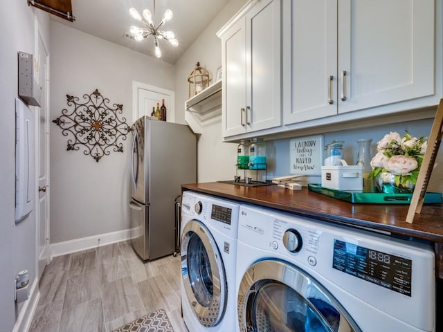 6209 Crystal Cove Ct, Mckinney, TX 75071 - laundry area with a chandelier, washing machine and dryer, and baseboards