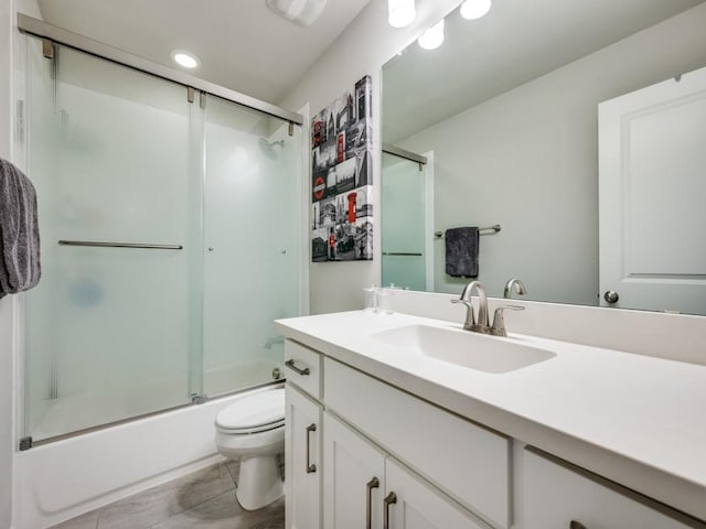 6209 Crystal Cove Ct, Mckinney, TX 75071 - bathroom featuring toilet, vanity, and enclosed tub / shower combo