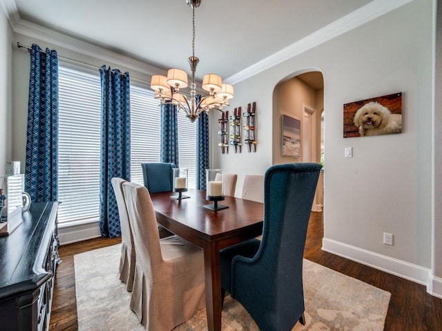 6209 Crystal Cove Ct, Mckinney, TX 75071 - dining room featuring a chandelier, arched walkways, baseboards, dark wood-style flooring, and crown molding