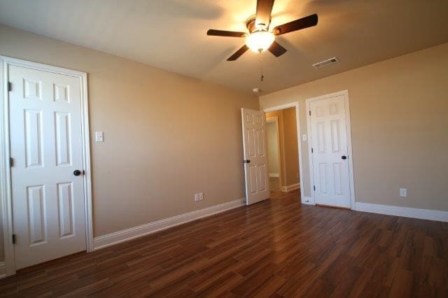 8036 Doreen Ave, Fort Worth, TX 76116 - unfurnished bedroom featuring wood finished floors, baseboards, and ceiling fan