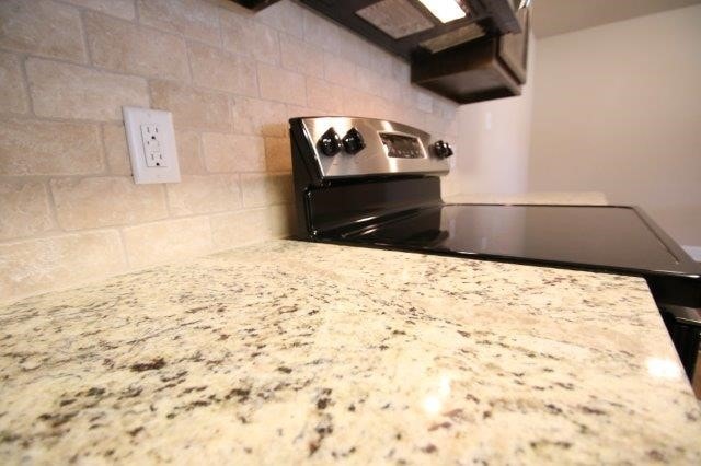 8036 Doreen Ave, Fort Worth, TX 76116 - kitchen view of decorative backsplash and light stone counters