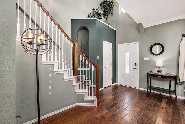 1516 Cheyenne Trl, Mansfield, TX 76063 - entryway with hardwood / wood-style flooring, stairs, baseboards, a towering ceiling, and ornamental molding