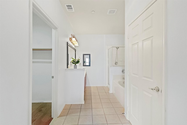 9904 Kaufman Pl, Plano, TX 75025 - bathroom featuring tile patterned flooring, vanity, baseboards, and a walk in closet