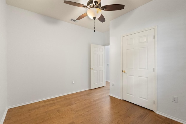 9904 Kaufman Pl, Plano, TX 75025 - empty room featuring light wood-style floors, a ceiling fan, and baseboards