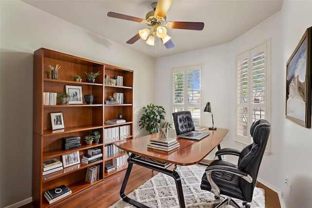 9904 Kaufman Pl, Plano, TX 75025 - home office featuring wood finished floors, a ceiling fan, and baseboards