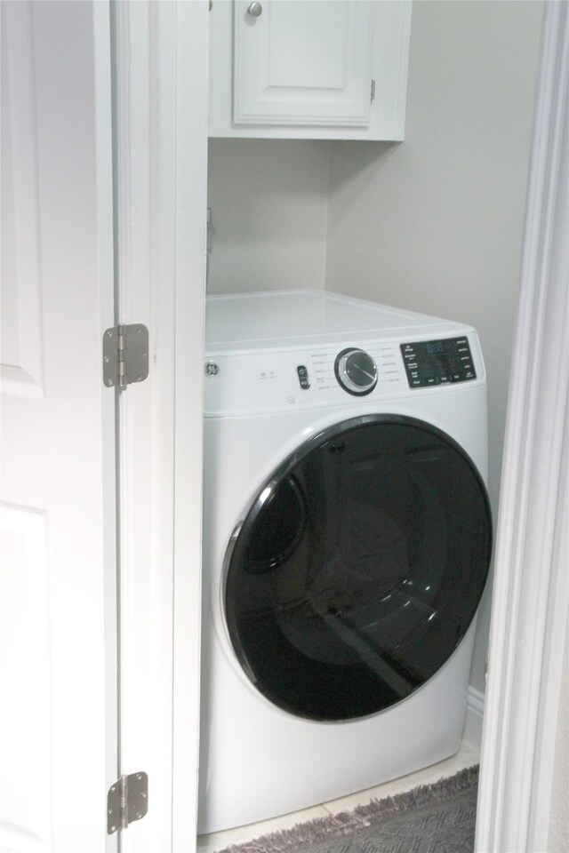 6700 Canalview Dr, Arlington, TX 76016 - clothes washing area with washer / clothes dryer and cabinet space