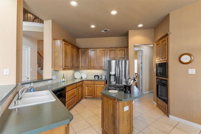 905 Sonora Dr, Allen, TX 75013 - kitchen with black appliances, backsplash, a center island, recessed lighting, and dark countertops