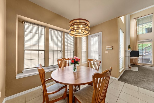 905 Sonora Dr, Allen, TX 75013 - dining room with a chandelier, light tile patterned flooring, baseboards, and light carpet