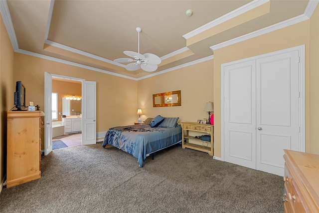 905 Sonora Dr, Allen, TX 75013 - carpeted bedroom featuring a tray ceiling, ornamental molding, ensuite bathroom, ceiling fan, and baseboards