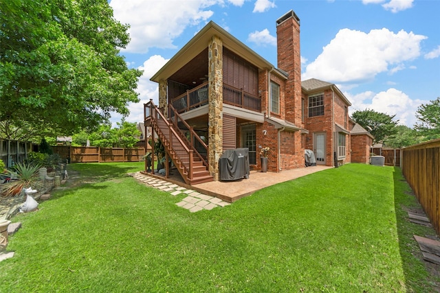 905 Sonora Dr, Allen, TX 75013 - back of house featuring a fenced backyard, a patio, a chimney, brick siding, and stairway