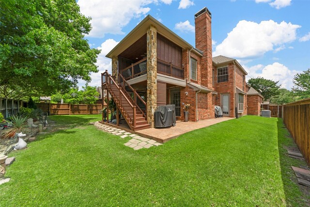 905 Sonora Dr, Allen, TX 75013 - back of house featuring a patio area, a chimney, brick siding, and stairway