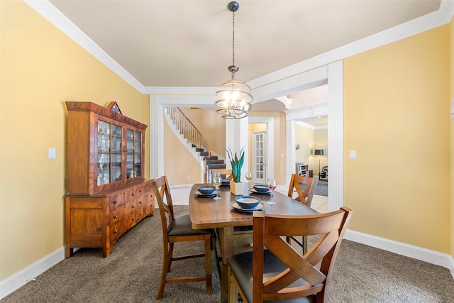905 Sonora Dr, Allen, TX 75013 - dining room with carpet, a chandelier, crown molding, and stairs