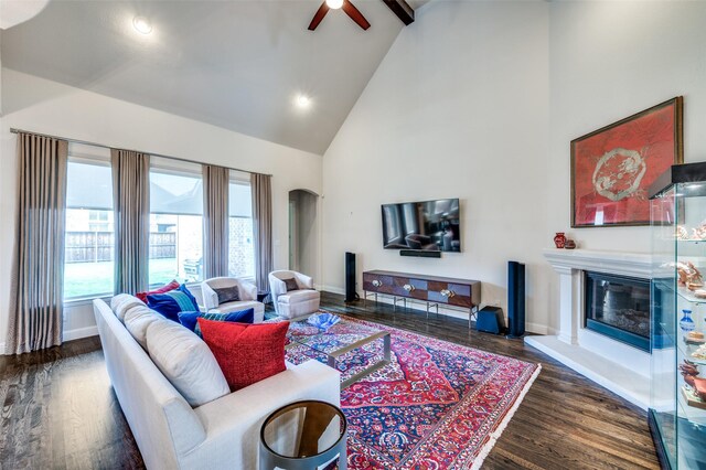 4388 Argyle Ln, Frisco, TX 75034 - living room featuring high vaulted ceiling, ceiling fan, arched walkways, wood finished floors, and baseboards