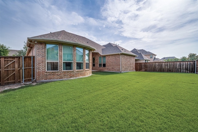 4388 Argyle Ln, Frisco, TX 75034 - back of house with brick siding and a shingled roof
