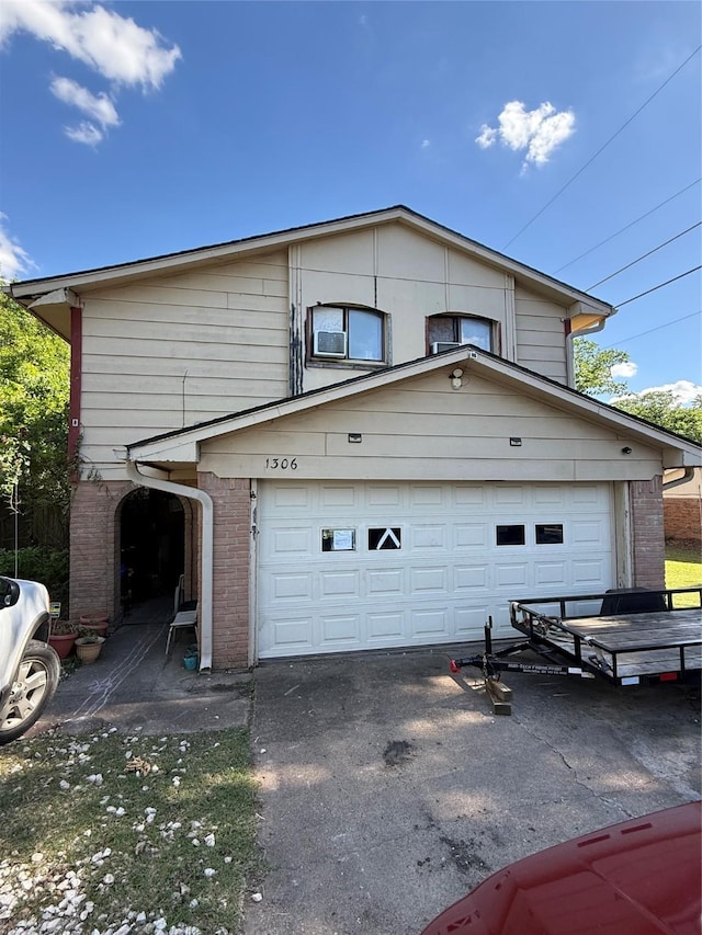 1306 La Salle Dr, Sherman, TX 75090 - view of property exterior with a garage, brick siding, and asphalt driveway