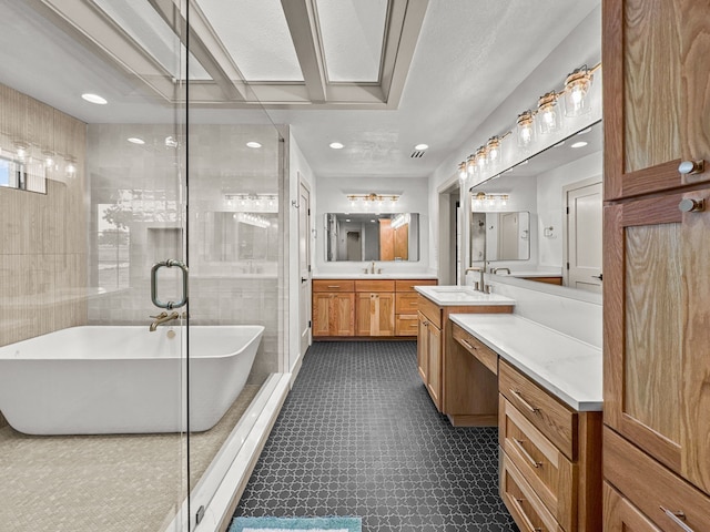 1551 Lower Tonk Valley Rd, Graham, TX 76450 - full bathroom with a freestanding bath, a stall shower, two vanities, and recessed lighting