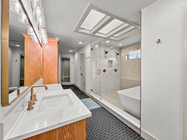 1551 Lower Tonk Valley Rd, Graham, TX 76450 - full bathroom featuring a shower stall, vanity, recessed lighting, and a skylight
