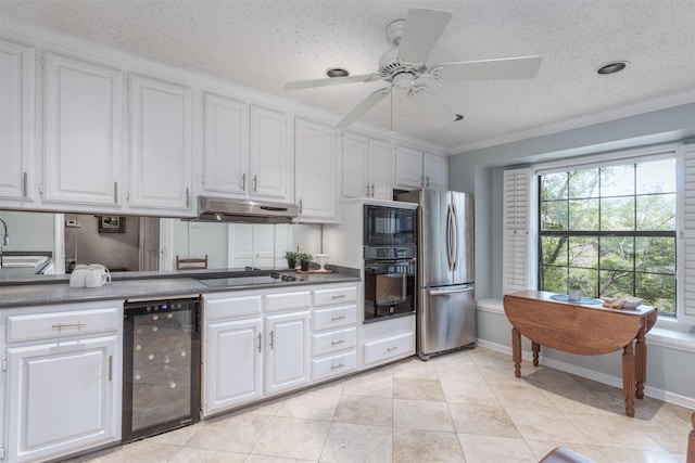 5158 Westgrove Dr, Dallas, TX 75248 - kitchen featuring beverage cooler, black appliances, under cabinet range hood, white cabinets, and crown molding