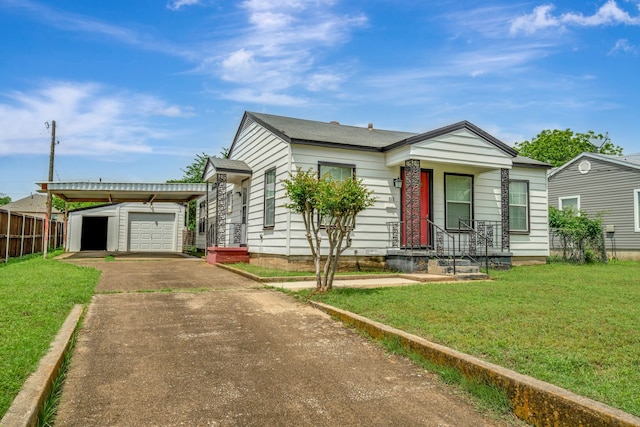 313 W 7th St, Irving, TX 75060 - view of front facade featuring driveway, an outbuilding, and a carport