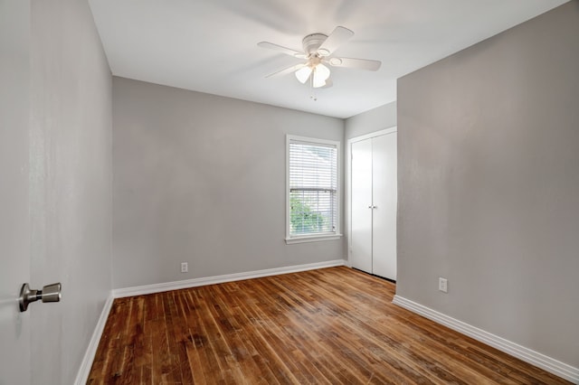 313 W 7th St, Irving, TX 75060 - spare room with baseboards, wood-type flooring, and a ceiling fan