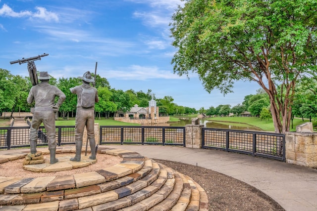 313 W 7th St, Irving, TX 75060 - view of community featuring a gate and a water view