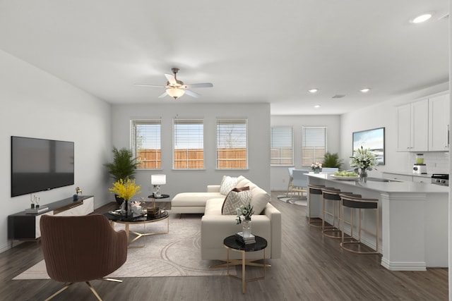 3008 Balmorhea Ln, Mckinney, TX 75071 - living room featuring dark wood finished floors, healthy amount of natural light, recessed lighting, a ceiling fan, and baseboards