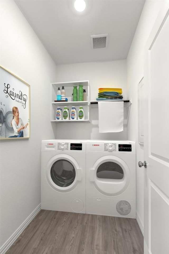 3008 Balmorhea Ln, Mckinney, TX 75071 - washroom with wood finished floors, washer and clothes dryer, and baseboards