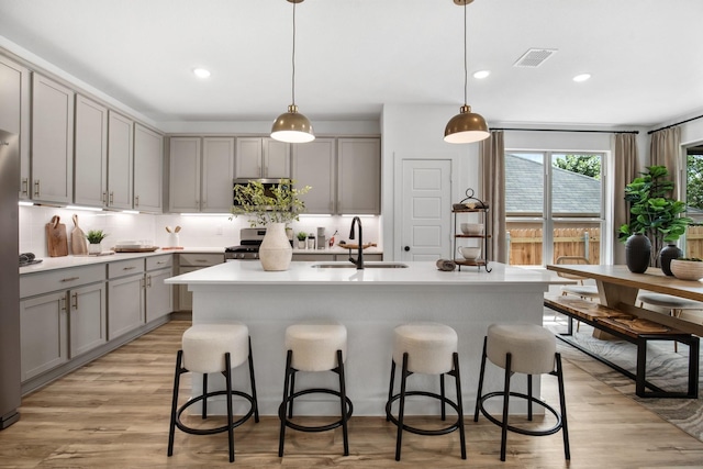 2396 High Pln, Waxahachie, TX 75167 - kitchen with gray cabinetry, a sink, stainless steel appliances, tasteful backsplash, and recessed lighting