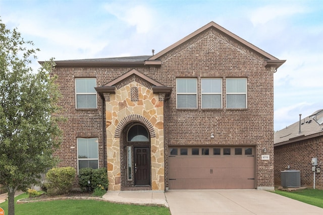 6712 Eliza Dr, Arlington, TX 76001 - view of front of home with brick siding, cooling unit, an attached garage, concrete driveway, and stone siding