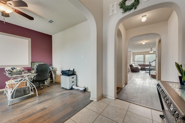 6712 Eliza Dr, Arlington, TX 76001 - office area with a ceiling fan, light wood finished floors, and arched walkways