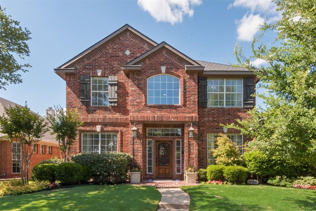 2466 Campfire Ln, Frisco, TX 75033 - view of front of house with brick siding and a front yard