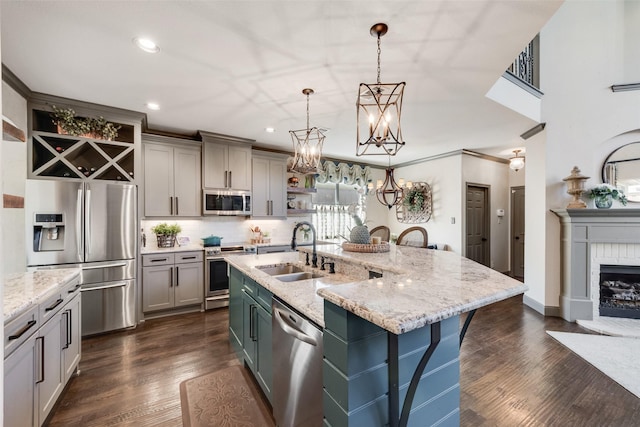 2466 Campfire Ln, Frisco, TX 75033 - kitchen featuring appliances with stainless steel finishes, a sink, open shelves, gray cabinetry, and recessed lighting