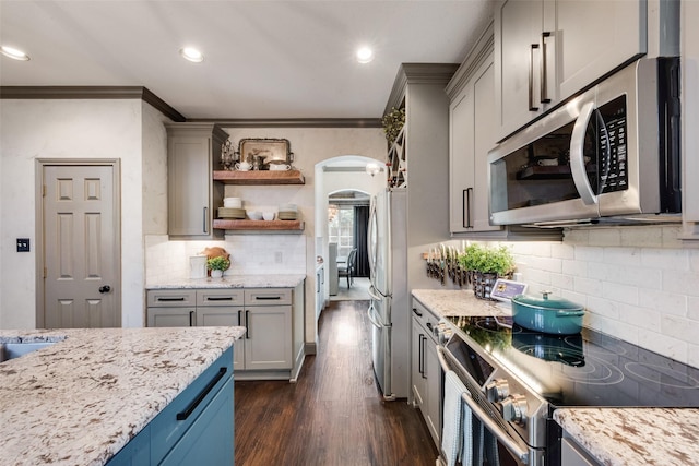 2466 Campfire Ln, Frisco, TX 75033 - kitchen featuring stainless steel appliances, ornamental molding, gray cabinets, tasteful backsplash, and open shelves